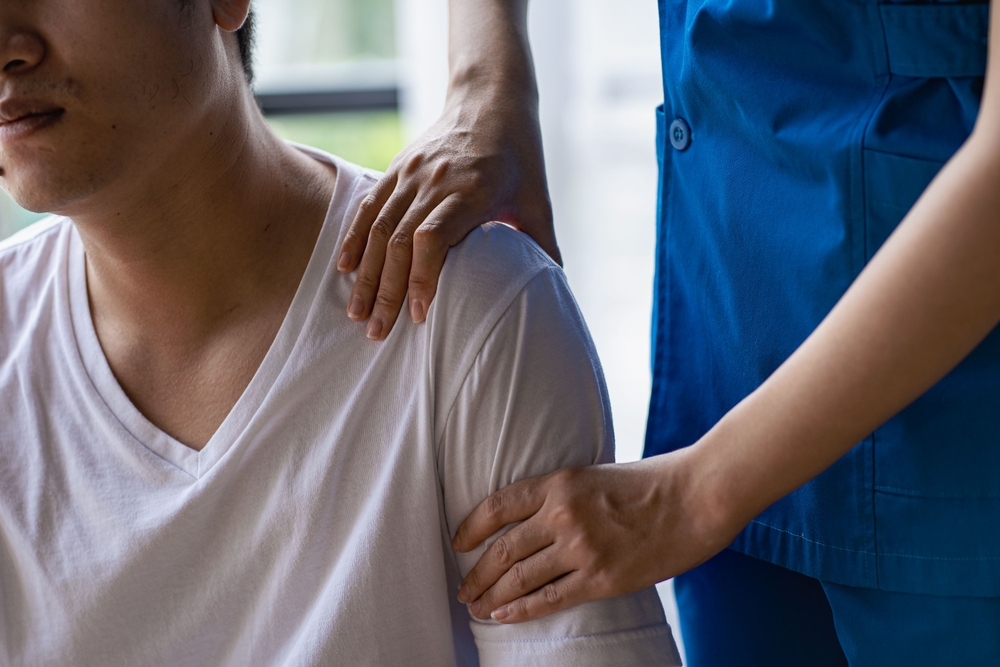 Massaging shoulder pain in Brooklyn